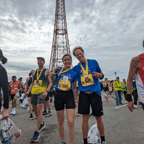 Runners on the Coney Island boardwalk near the Parachute Jump