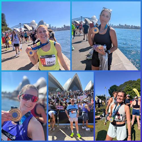 Finishers with their medals by the Sydney Opera House
